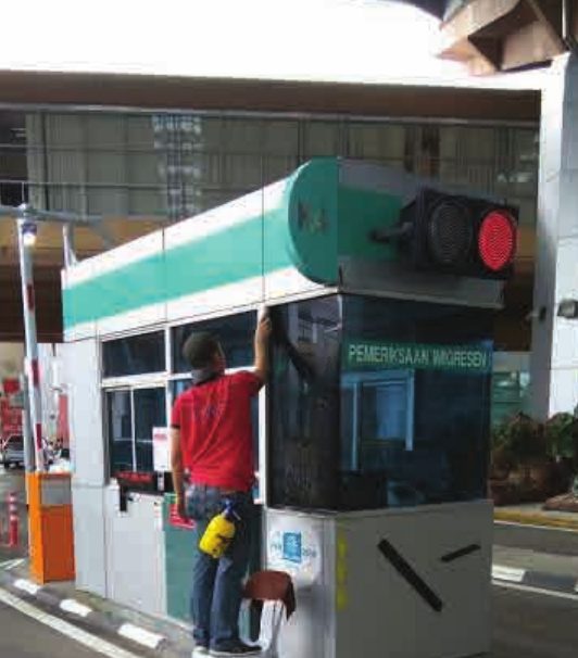 Installing window film at a toll booth